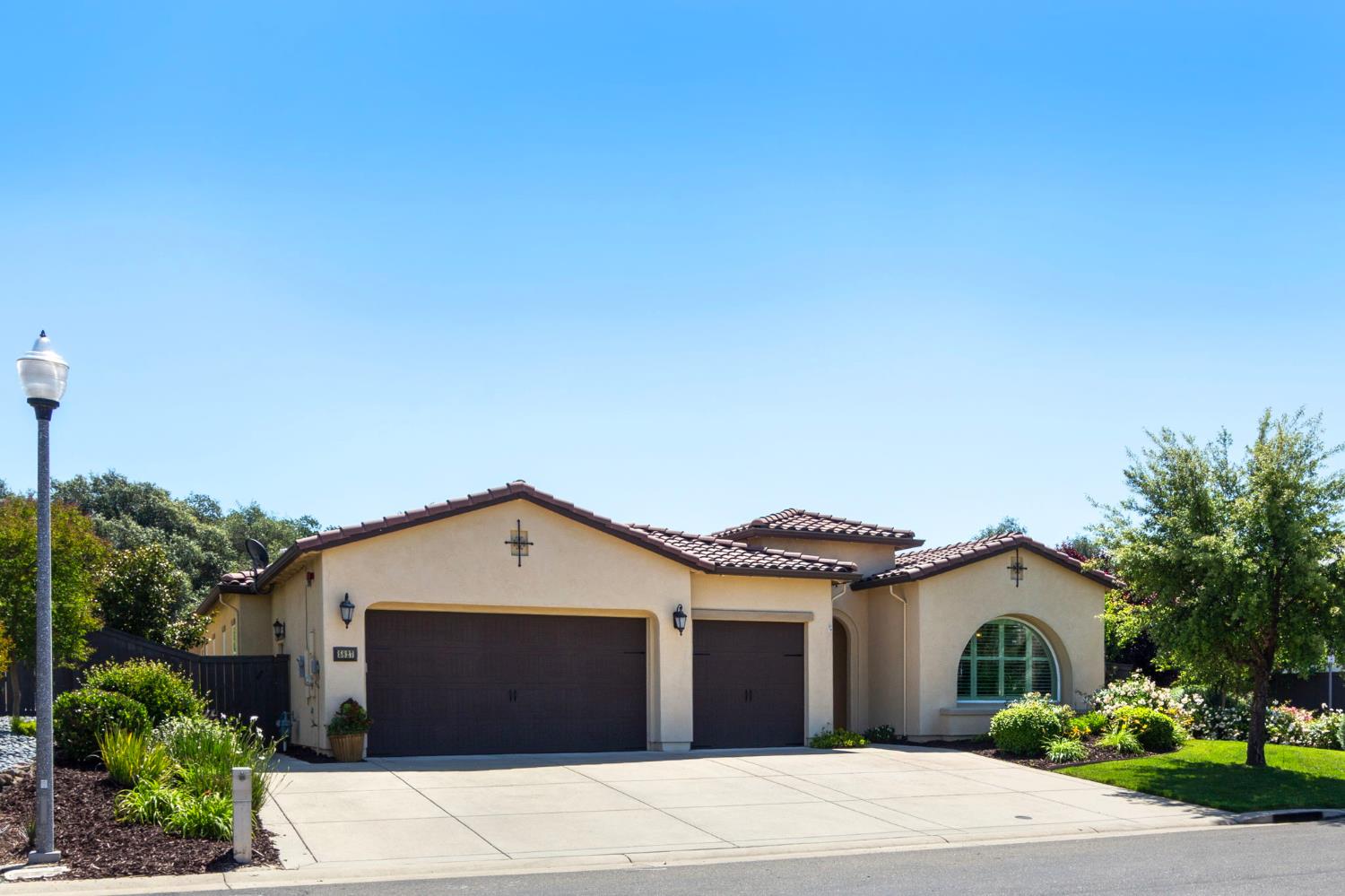 5827 Tree Swallow Circle Rocklin, CA 95677 - Photo 1 of 1 a front view of a house with a yard and garage