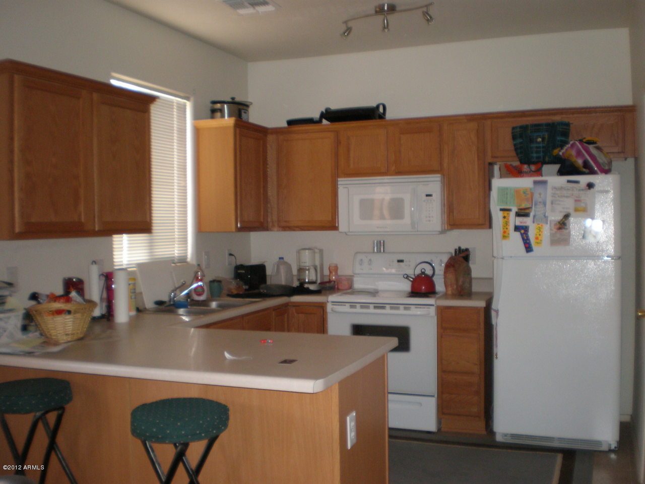 2300 East Magma Road San Tan Valley, AZ 85143 - Photo 2 of 10 a kitchen with a sink a stove and cabinets