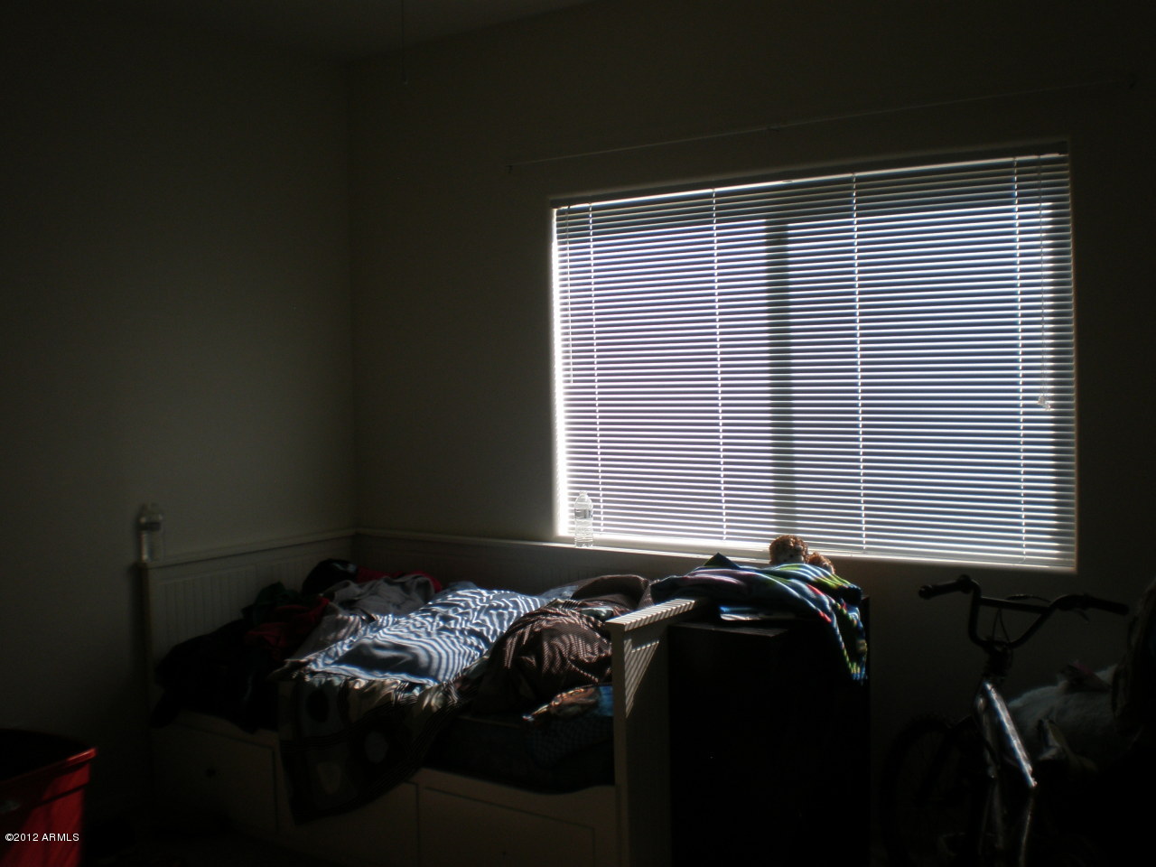 2300 East Magma Road San Tan Valley, AZ 85143 - Photo 8 of 10 a bed sitting in a bedroom next to a window