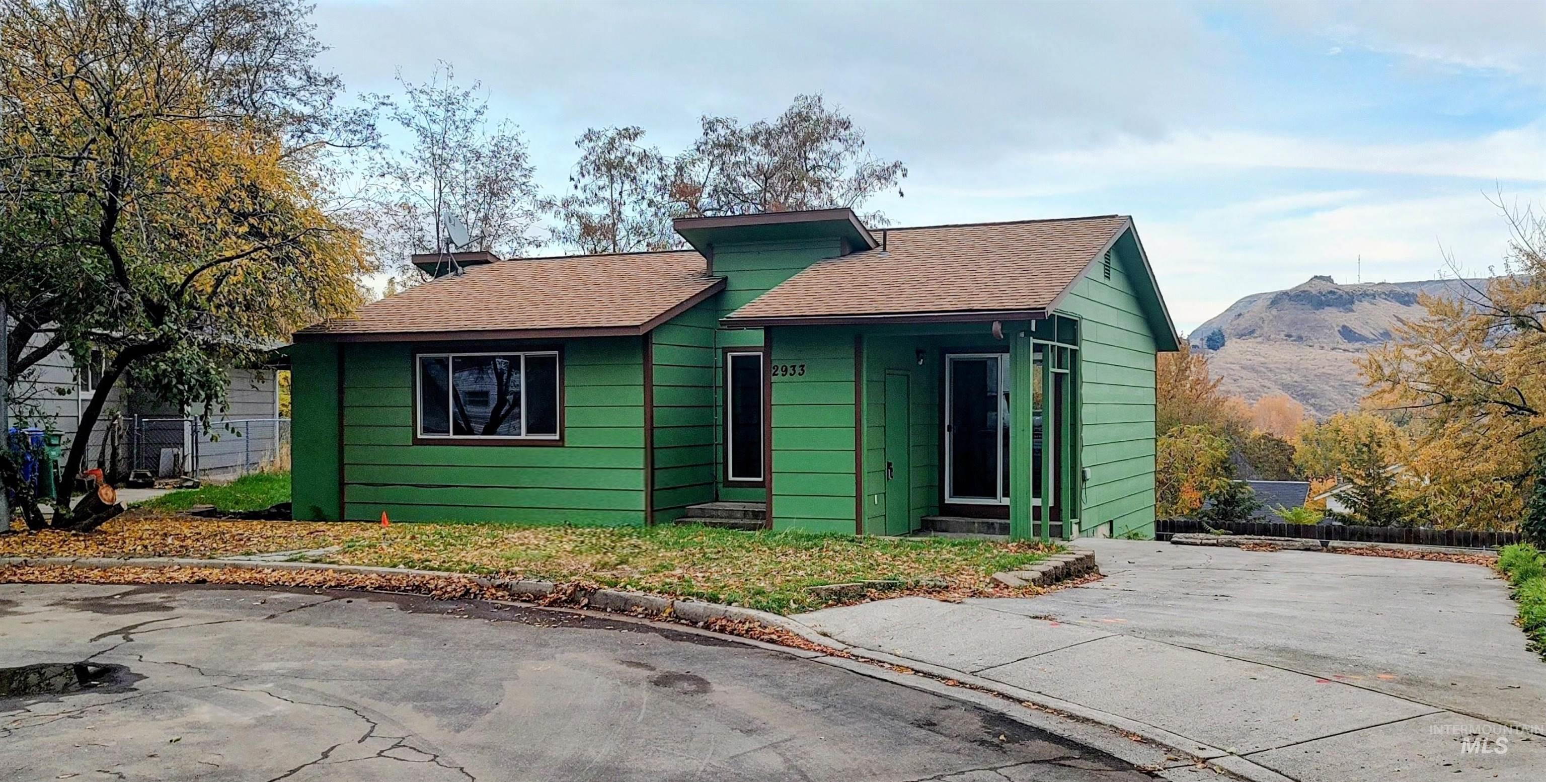 View of front of house with a shingled roof