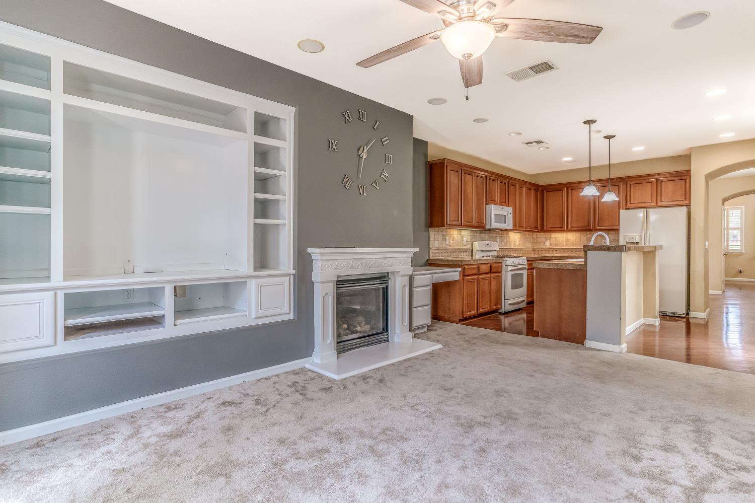 188 Thomsen Road Lathrop, CA 95330 - Photo 13 of 27 a open kitchen with cabinets and a fireplace