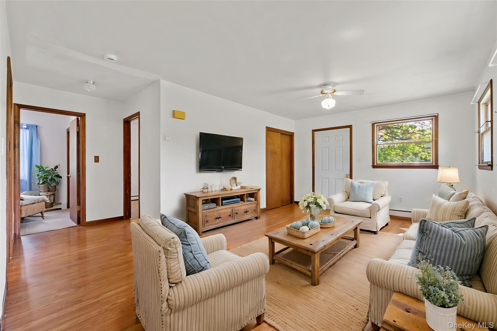 89 Brown Road Wappingers Falls, NY 12590 - Photo 12 of 19 a living room with furniture kitchen view and a flat screen tv