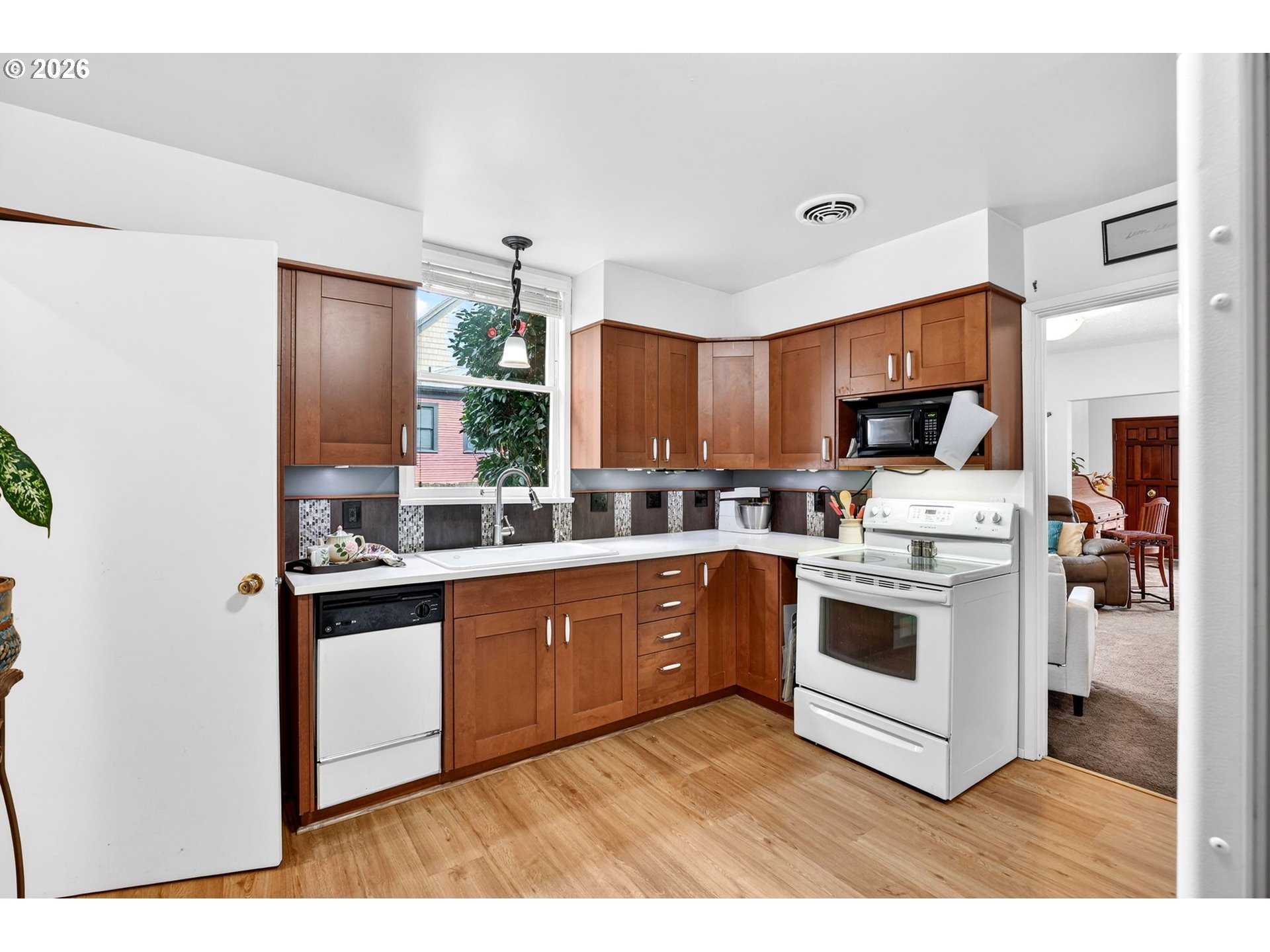 2820 Northeast Oregon Street Portland, OR 97232 - Photo 11 of 41 a kitchen with stainless steel appliances granite countertop a stove a sink and a refrigerator