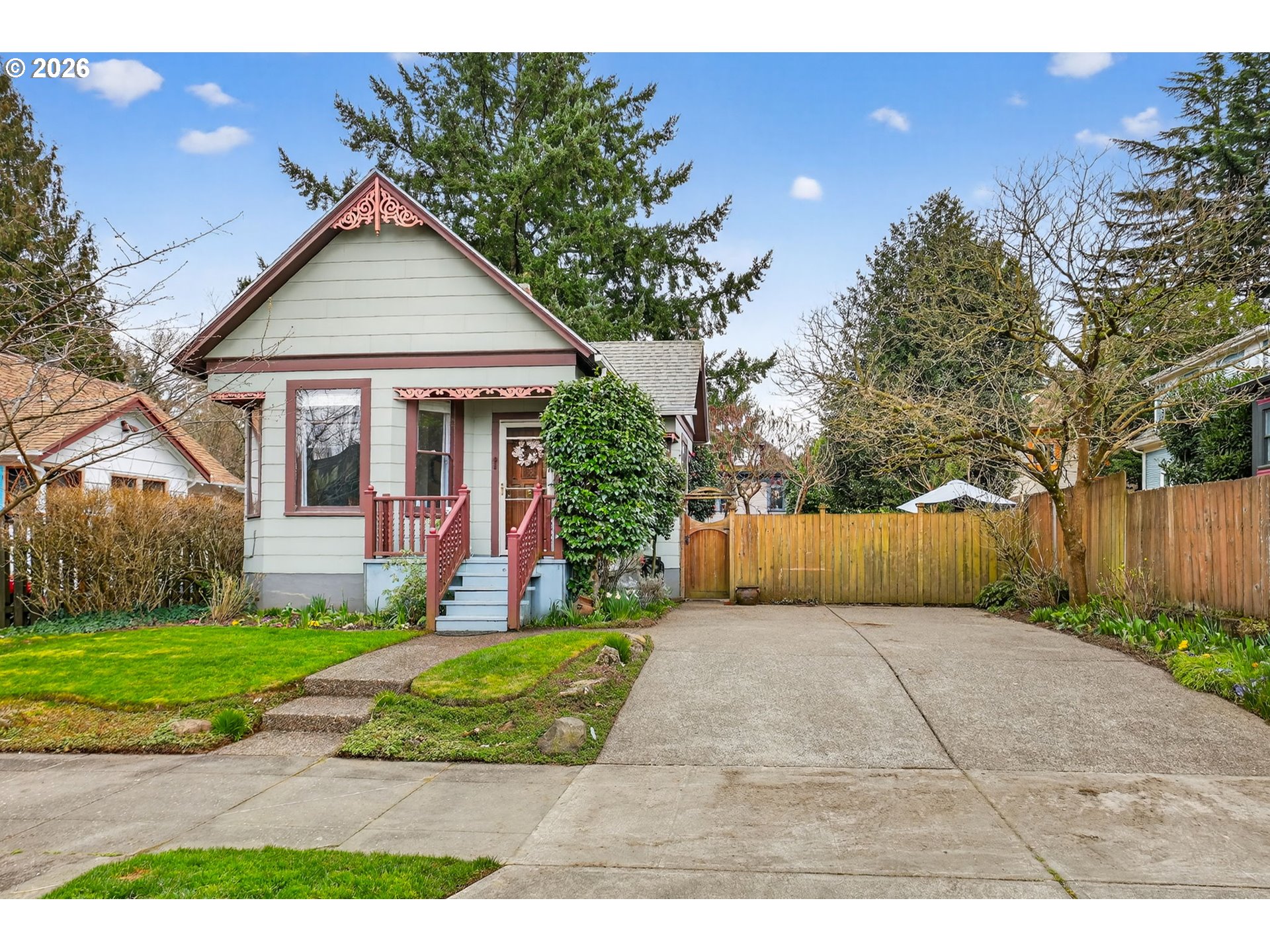 2820 Northeast Oregon Street Portland, OR 97232 - Photo 23 of 41 a front view of a house with a yard and potted plants