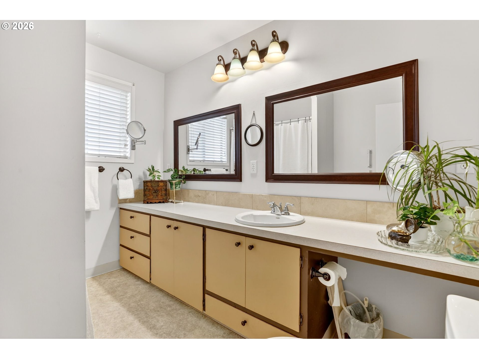 2820 Northeast Oregon Street Portland, OR 97232 - Photo 25 of 41 a bathroom with a sink and a mirror