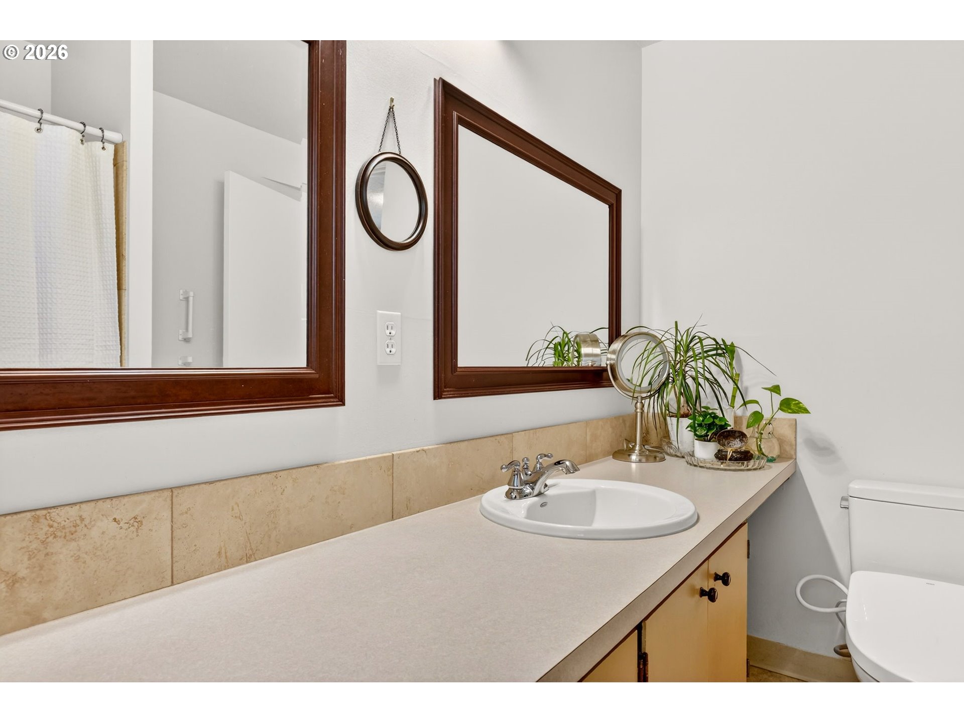 2820 Northeast Oregon Street Portland, OR 97232 - Photo 26 of 41 a bathroom with a sink vanity and a mirror