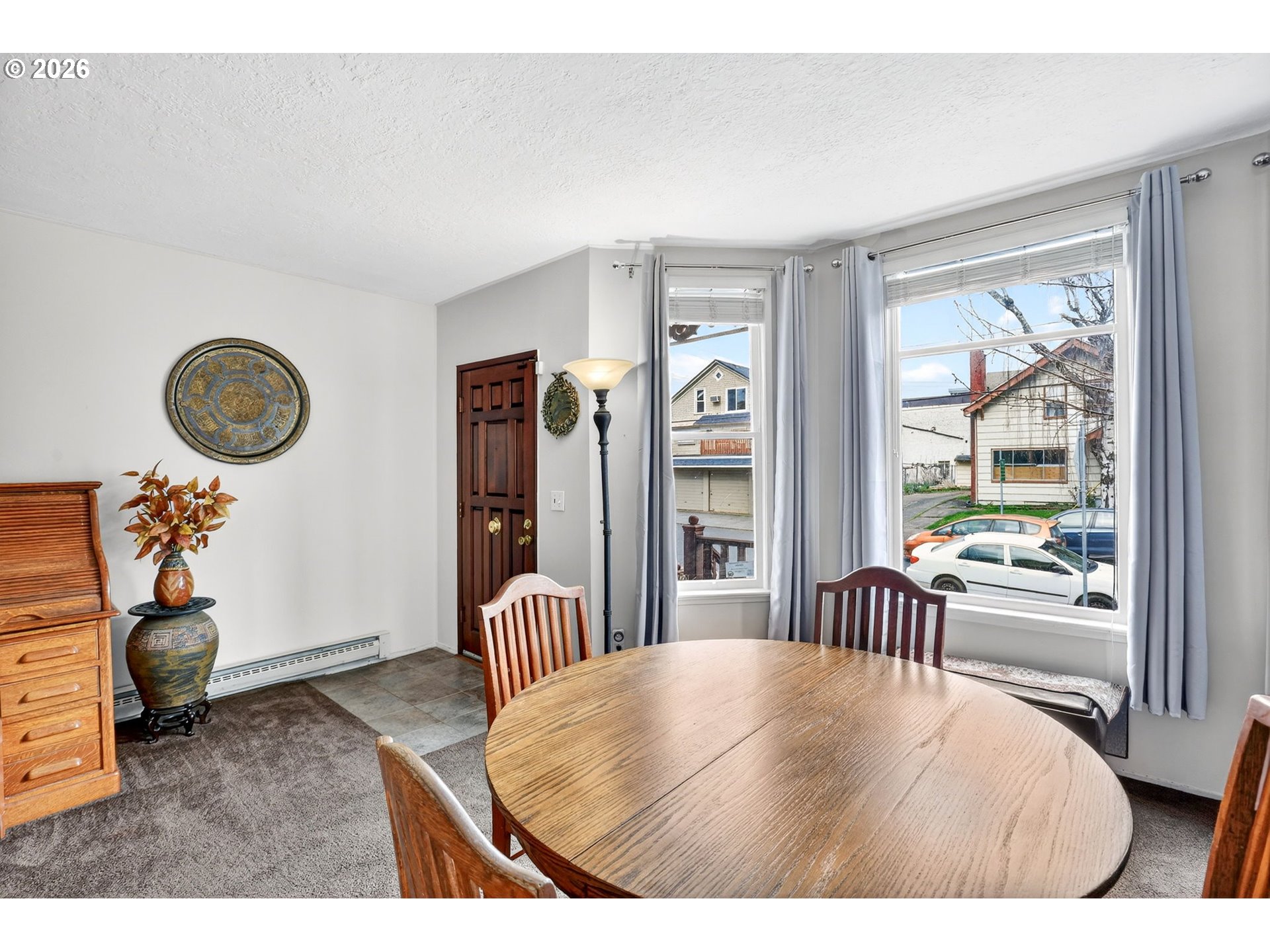 2820 Northeast Oregon Street Portland, OR 97232 - Photo 3 of 41 a bedroom with a bed and a large window