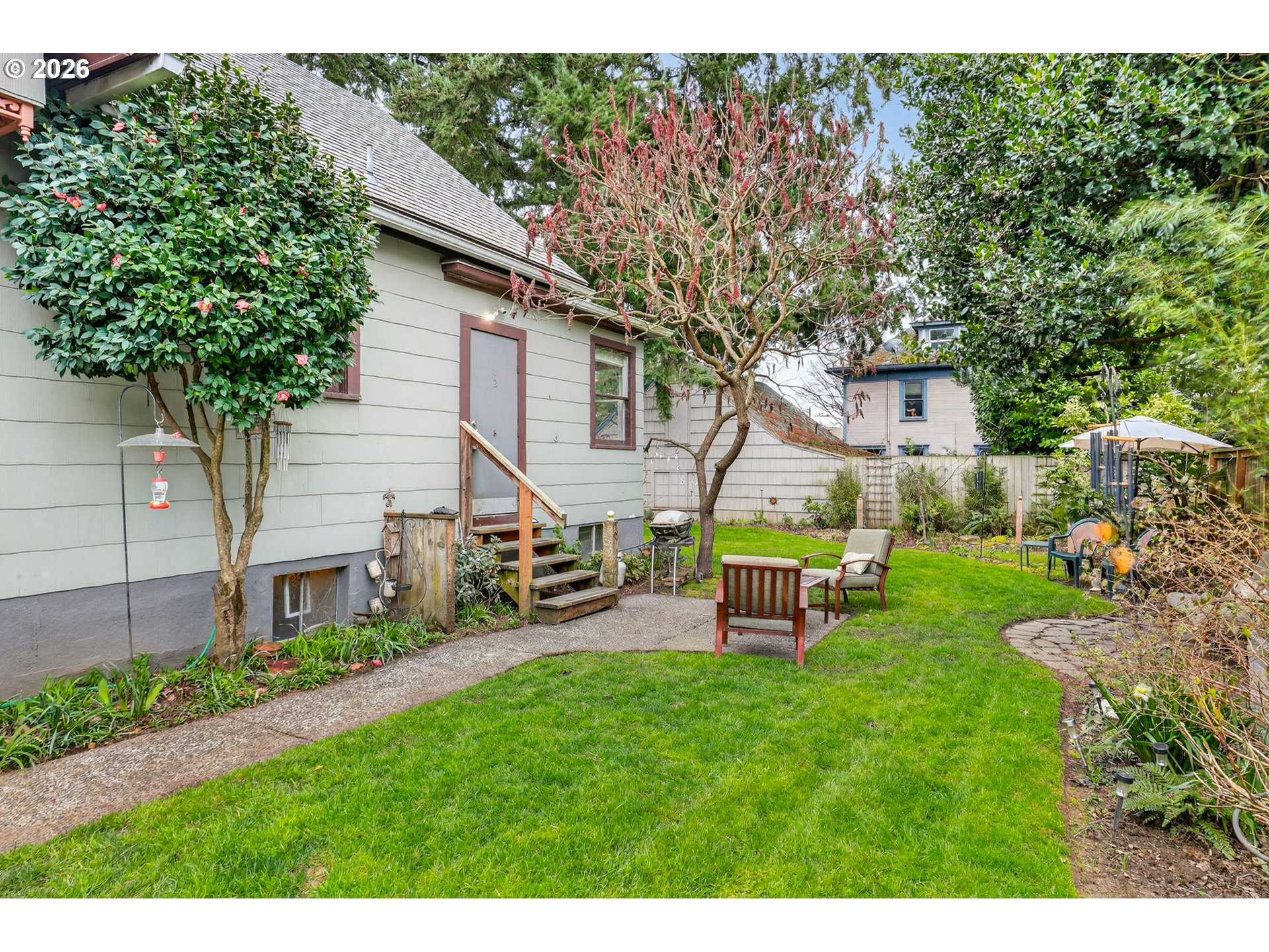 2820 Northeast Oregon Street Portland, OR 97232 - Photo 32 of 41 a view of a house with backyard and a sitting area