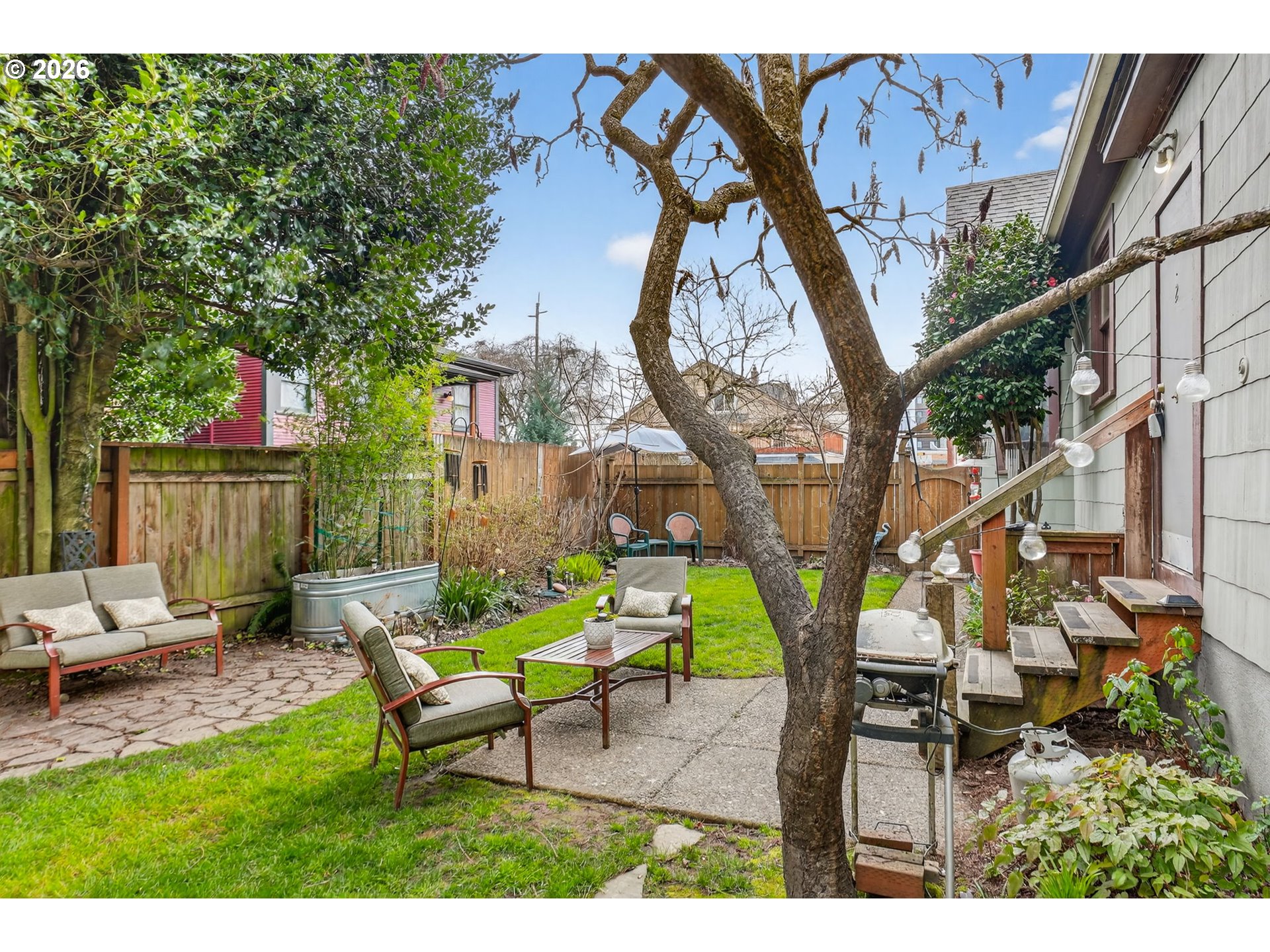 2820 Northeast Oregon Street Portland, OR 97232 - Photo 33 of 41 a backyard of a house with table and chairs