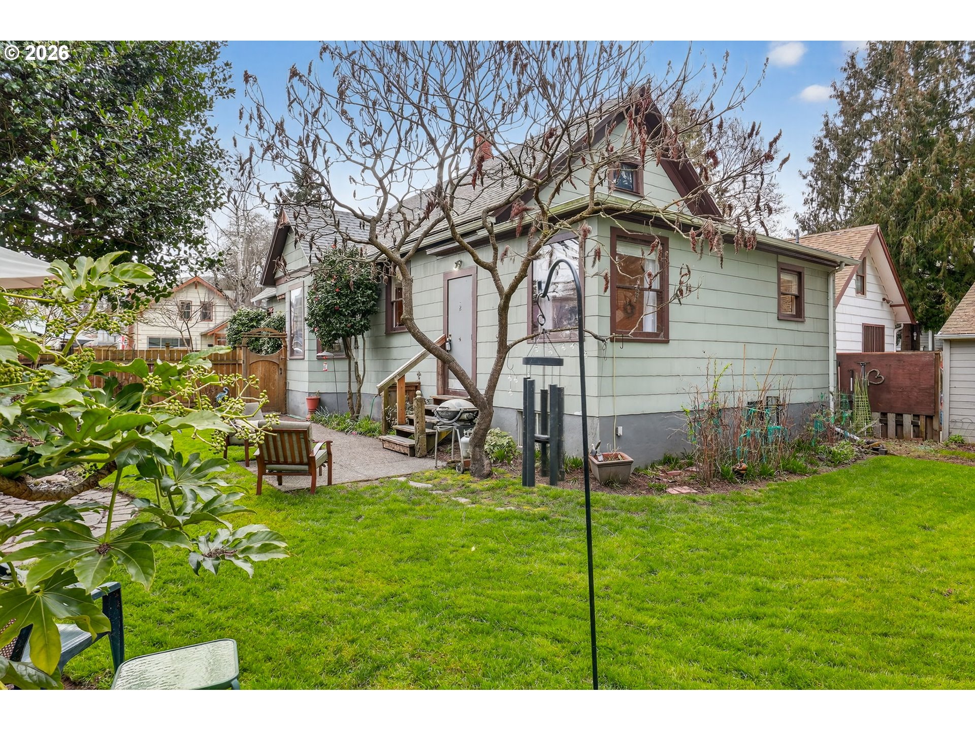 2820 Northeast Oregon Street Portland, OR 97232 - Photo 35 of 41 a backyard of a house with table and chairs