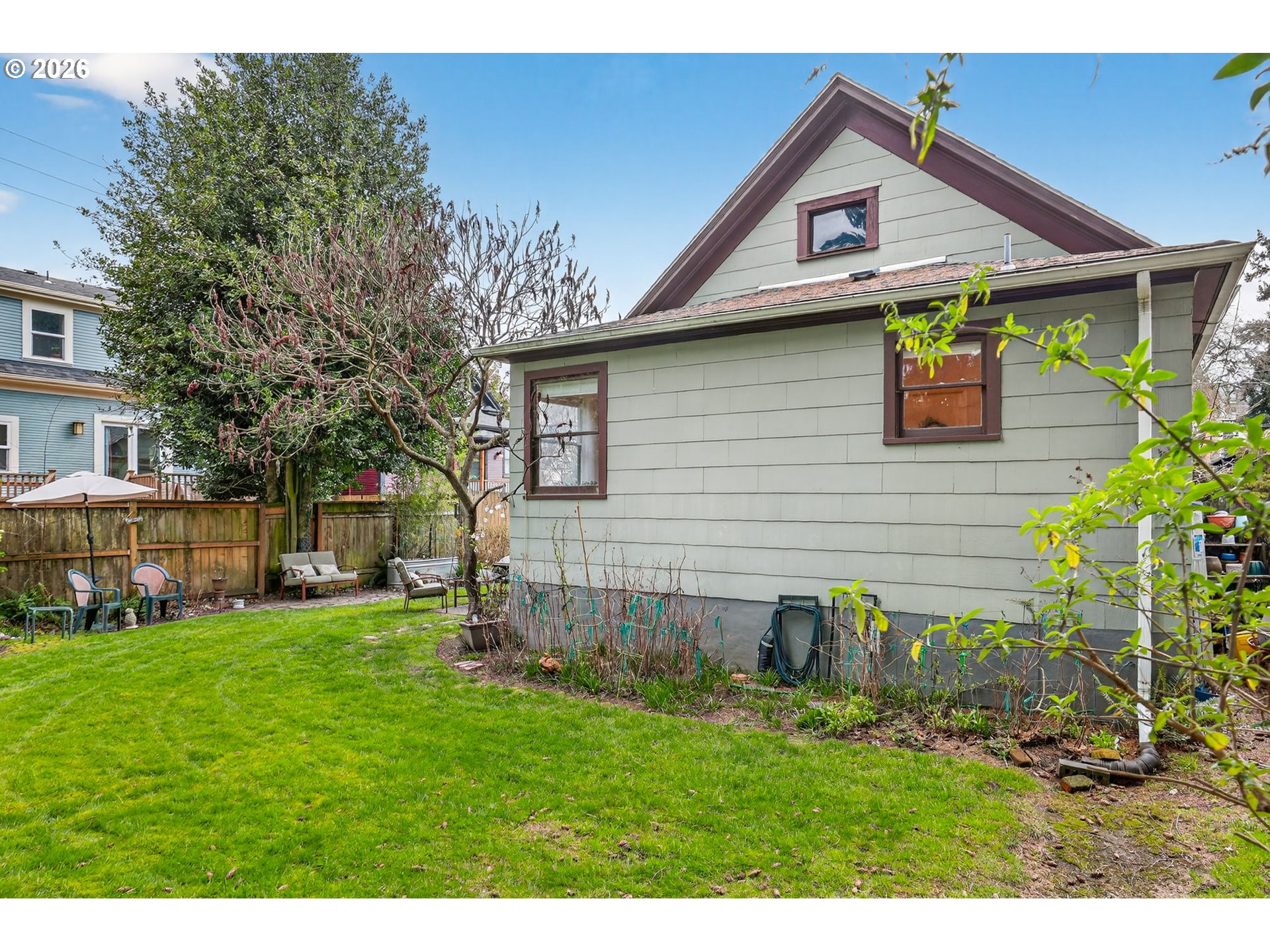 2820 Northeast Oregon Street Portland, OR 97232 - Photo 36 of 41 a view of a yard in front of a house with plants and large tree