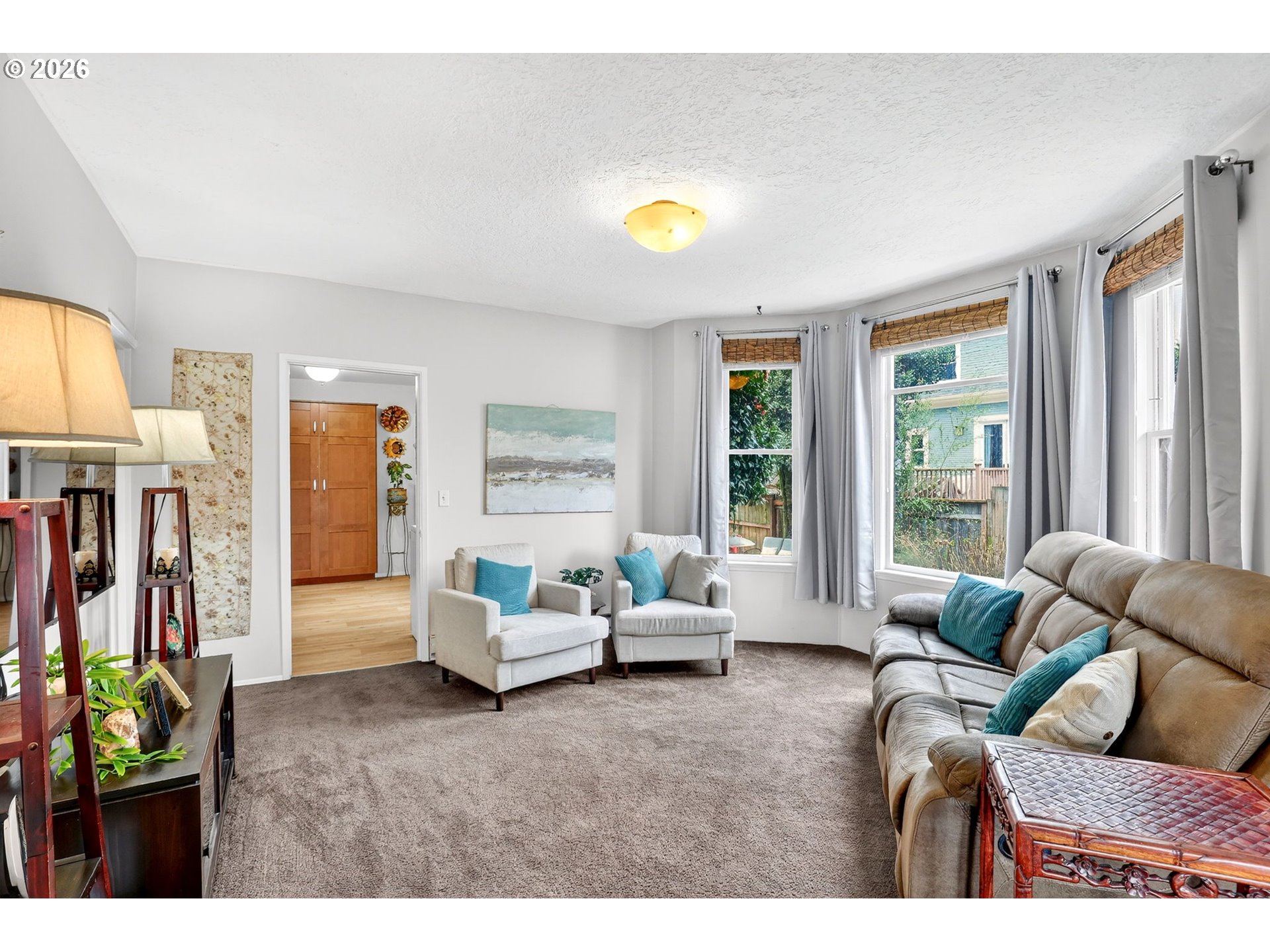 2820 Northeast Oregon Street Portland, OR 97232 - Photo 4 of 41 a living room with furniture and a flat screen tv