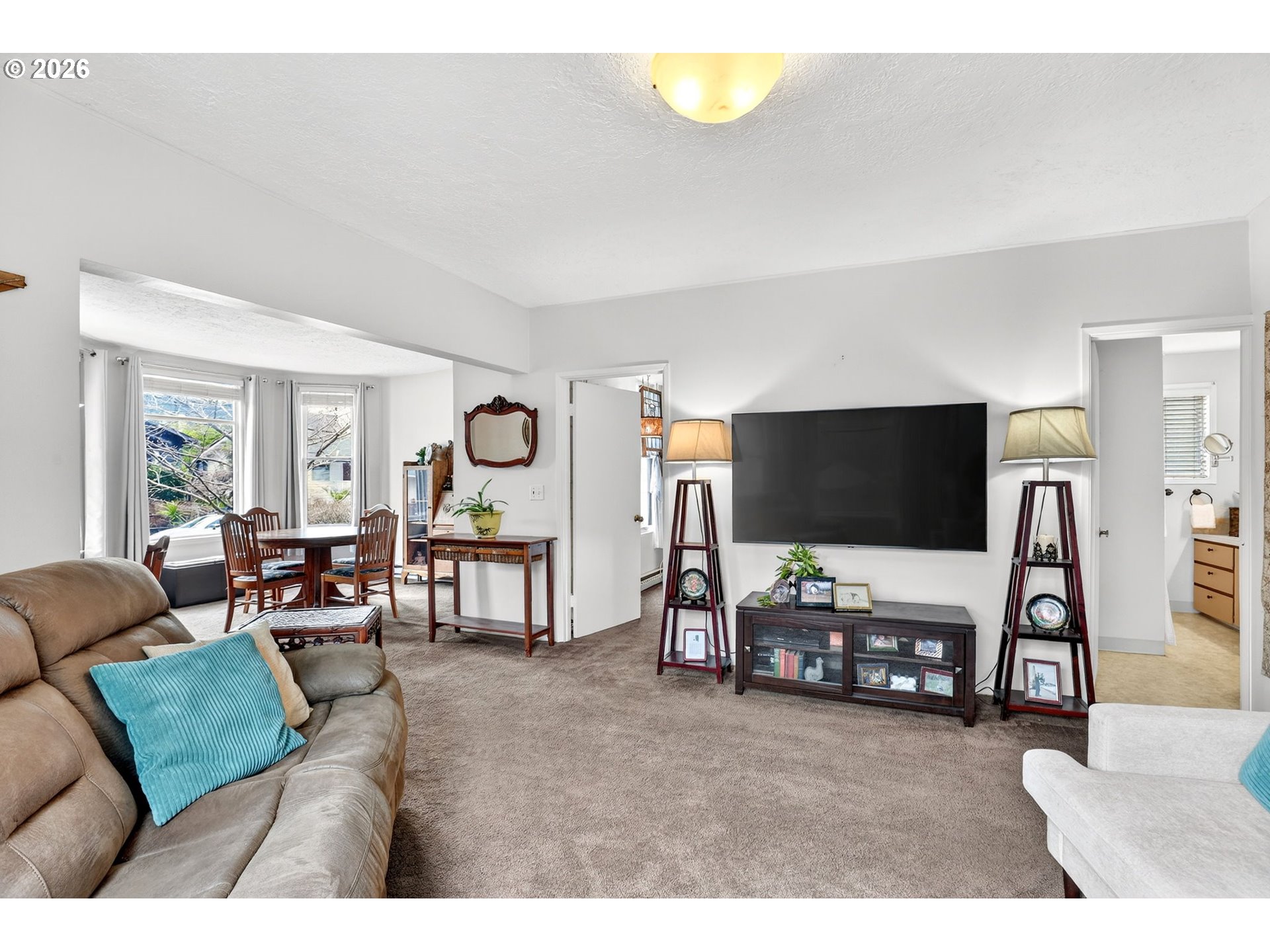 2820 Northeast Oregon Street Portland, OR 97232 - Photo 6 of 41 a living room with furniture and a flat screen tv