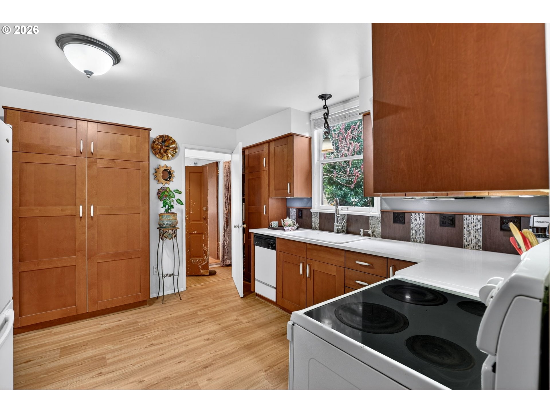 2820 Northeast Oregon Street Portland, OR 97232 - Photo 10 of 41 a kitchen that has a sink and a stove in it