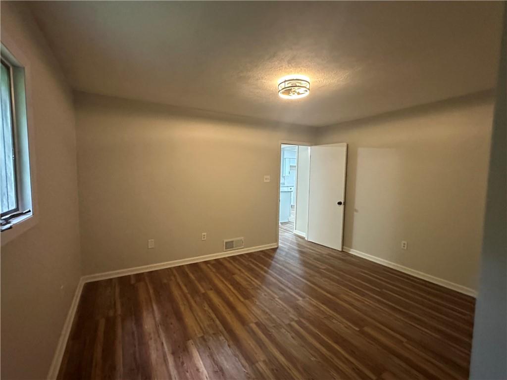 201 Clever Road McKees Rocks, PA 15136 - Photo 20 of 30 an empty room with wooden floor and windows