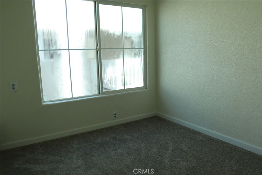 1855 East Riverside Drive, Unit 48 Ontario, CA 91761 - Photo 13 of 20 a view of an empty room with a window