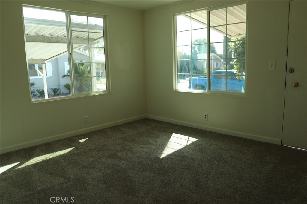 1855 East Riverside Drive, Unit 48 Ontario, CA 91761 - Photo 15 of 20 a view of an empty room and window