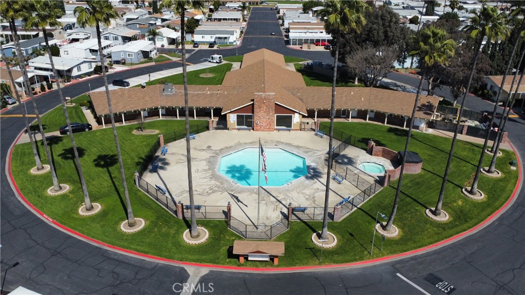 1855 East Riverside Drive, Unit 48 Ontario, CA 91761 - Photo 16 of 20 an aerial view of a chairs and table in patio