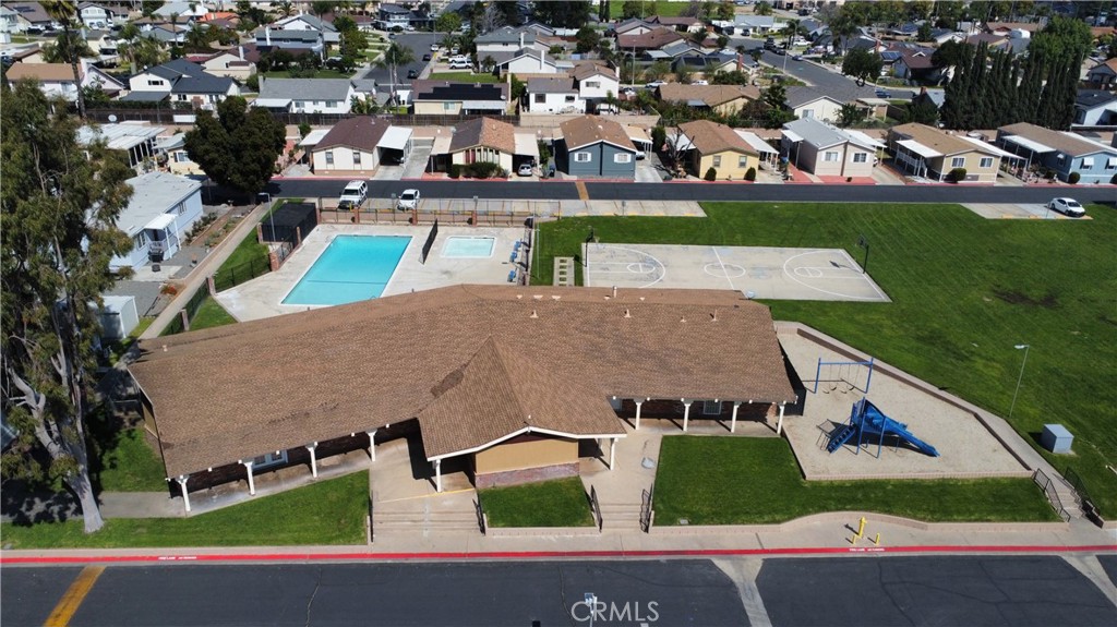 1855 East Riverside Drive, Unit 48 Ontario, CA 91761 - Photo 17 of 20 an aerial view of residential houses with outdoor space and street view
