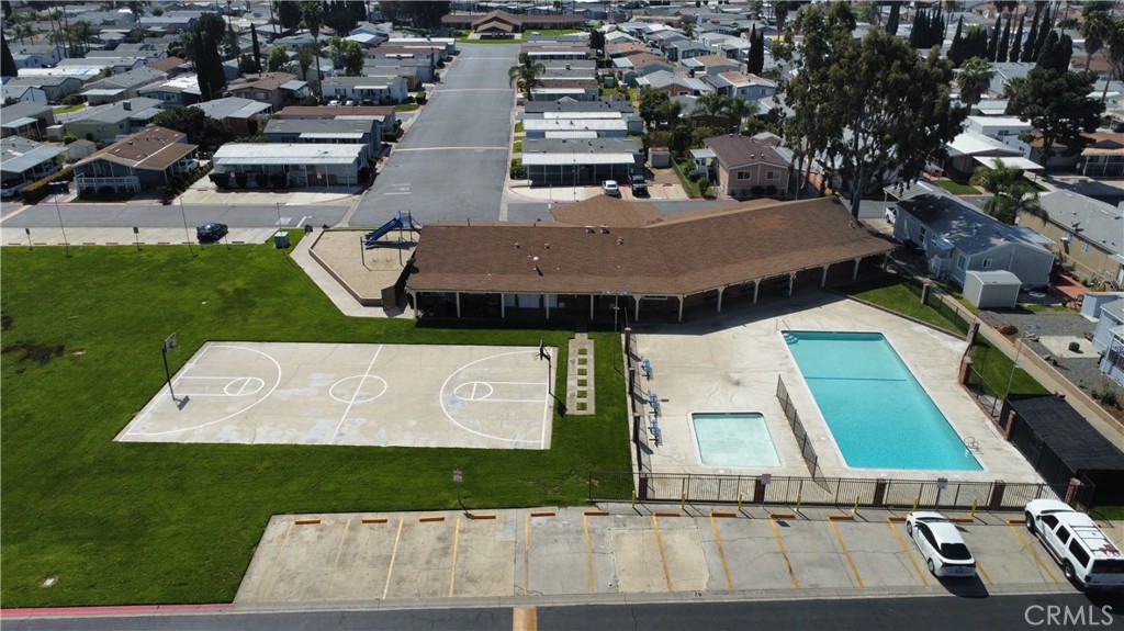 1855 East Riverside Drive, Unit 48 Ontario, CA 91761 - Photo 18 of 20 an aerial view of a house with a yard
