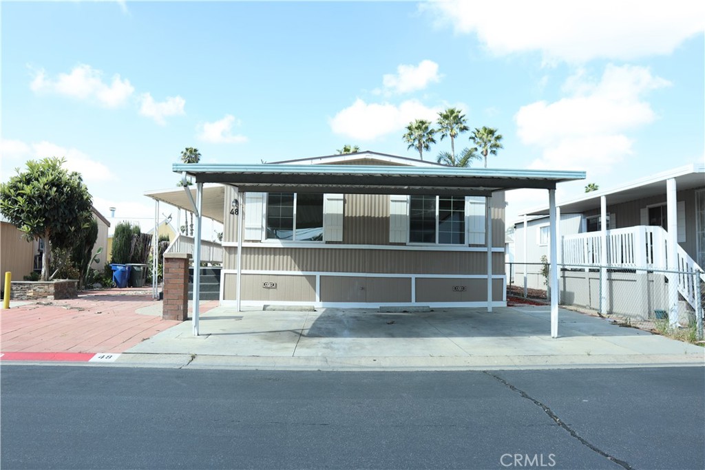 1855 East Riverside Drive, Unit 48 Ontario, CA 91761 - Photo 2 of 20 a view of a house with a outdoor space