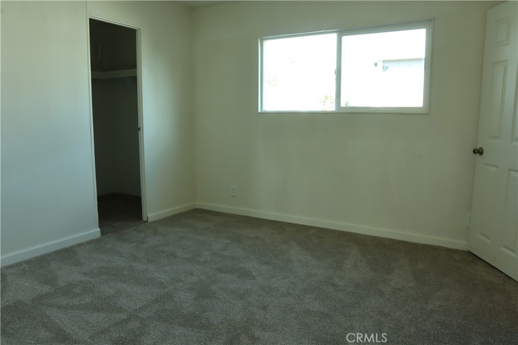 1855 East Riverside Drive, Unit 48 Ontario, CA 91761 - Photo 10 of 20 an empty room with a window