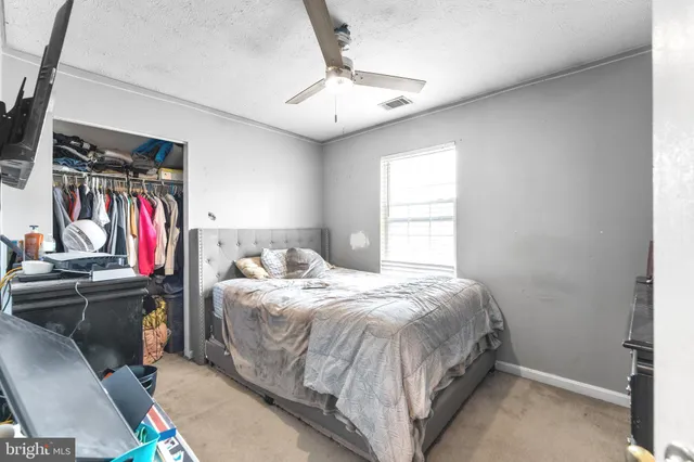 a bathroom with a toilet a sink and a mirror