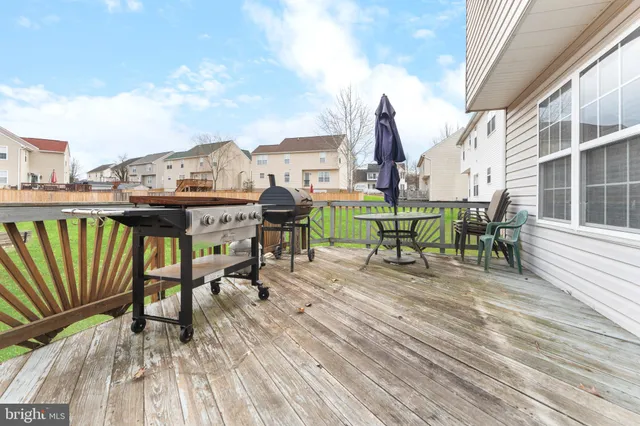 a view of a big room with table and chairs