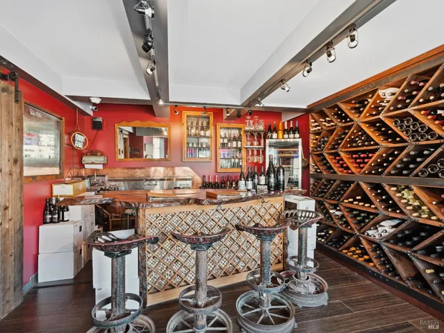 a view of a dining room with furniture wooden floor and chandelier