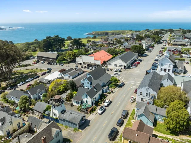 an aerial view of residential houses with outdoor space