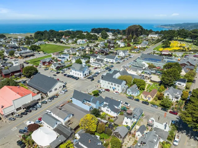 an aerial view of residential houses with outdoor space