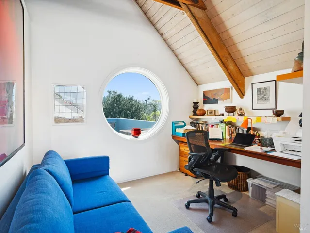 a spacious bathroom with a bathtub shower sink mirror and toilet