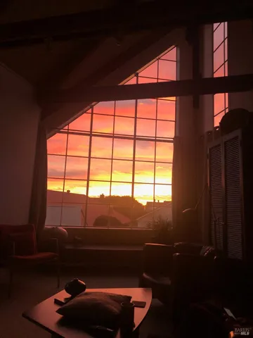 a view of a swimming pool with an outdoor seating