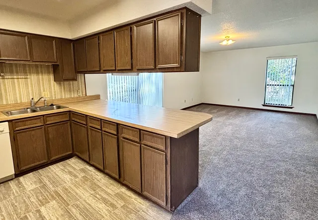 a kitchen with a sink and cabinets