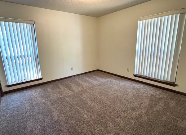 an empty room with windows