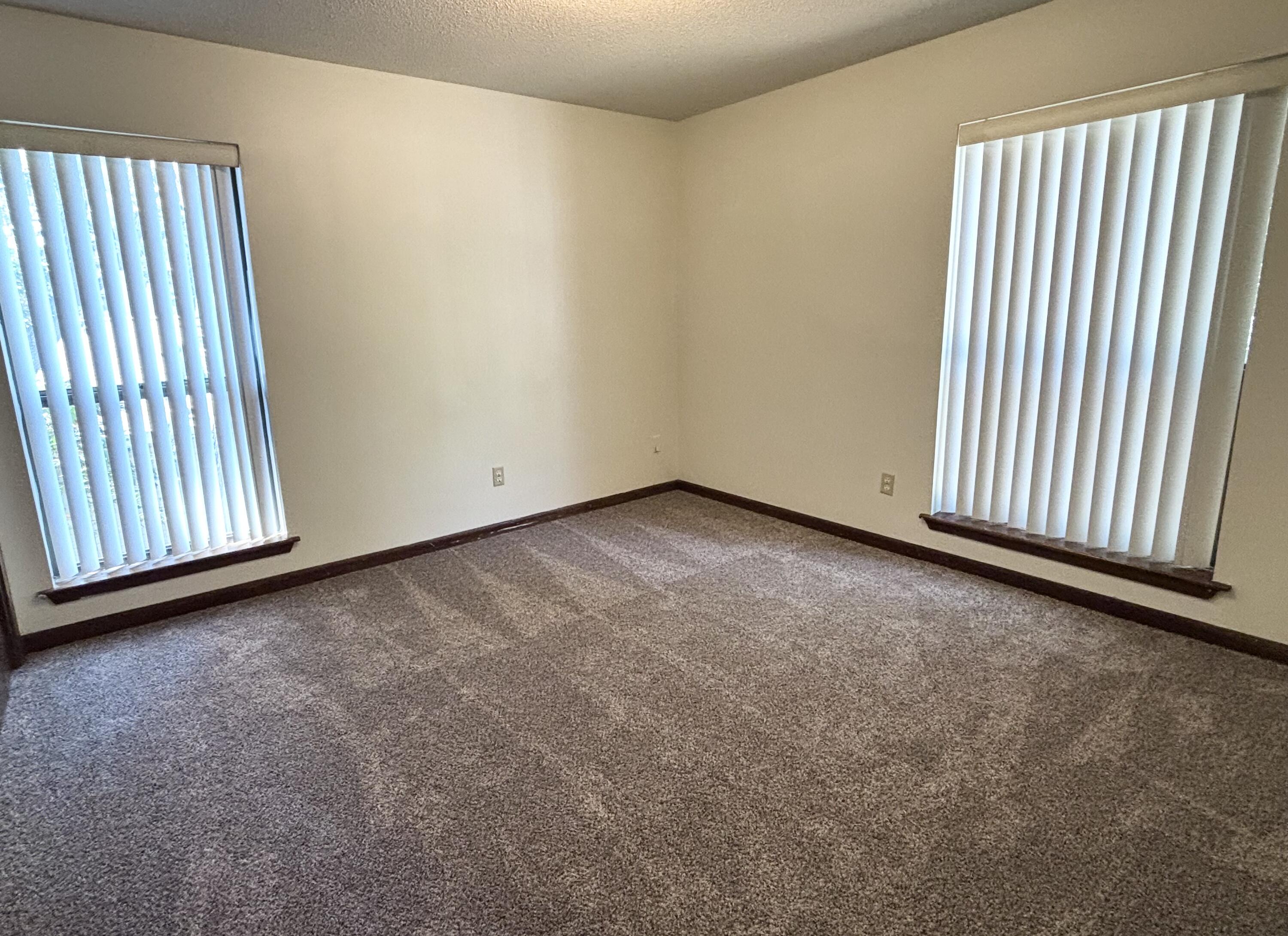 337 Lewis Street, Unit F Fort Walton Beach, FL 32547 - Photo 7 of 10 an empty room with windows