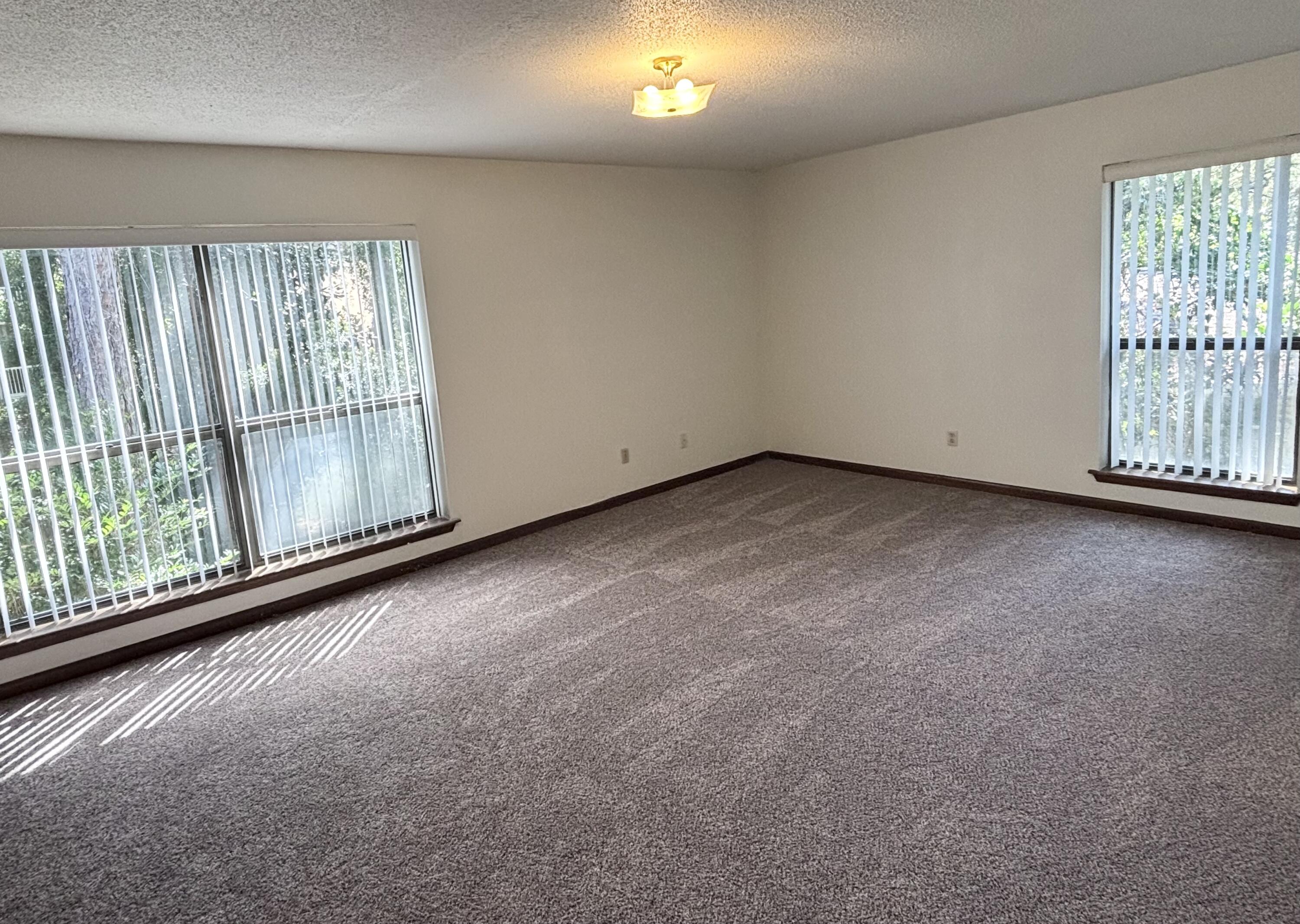 337 Lewis Street, Unit F Fort Walton Beach, FL 32547 - Photo 9 of 10 a view of a room with wooden floor and windows