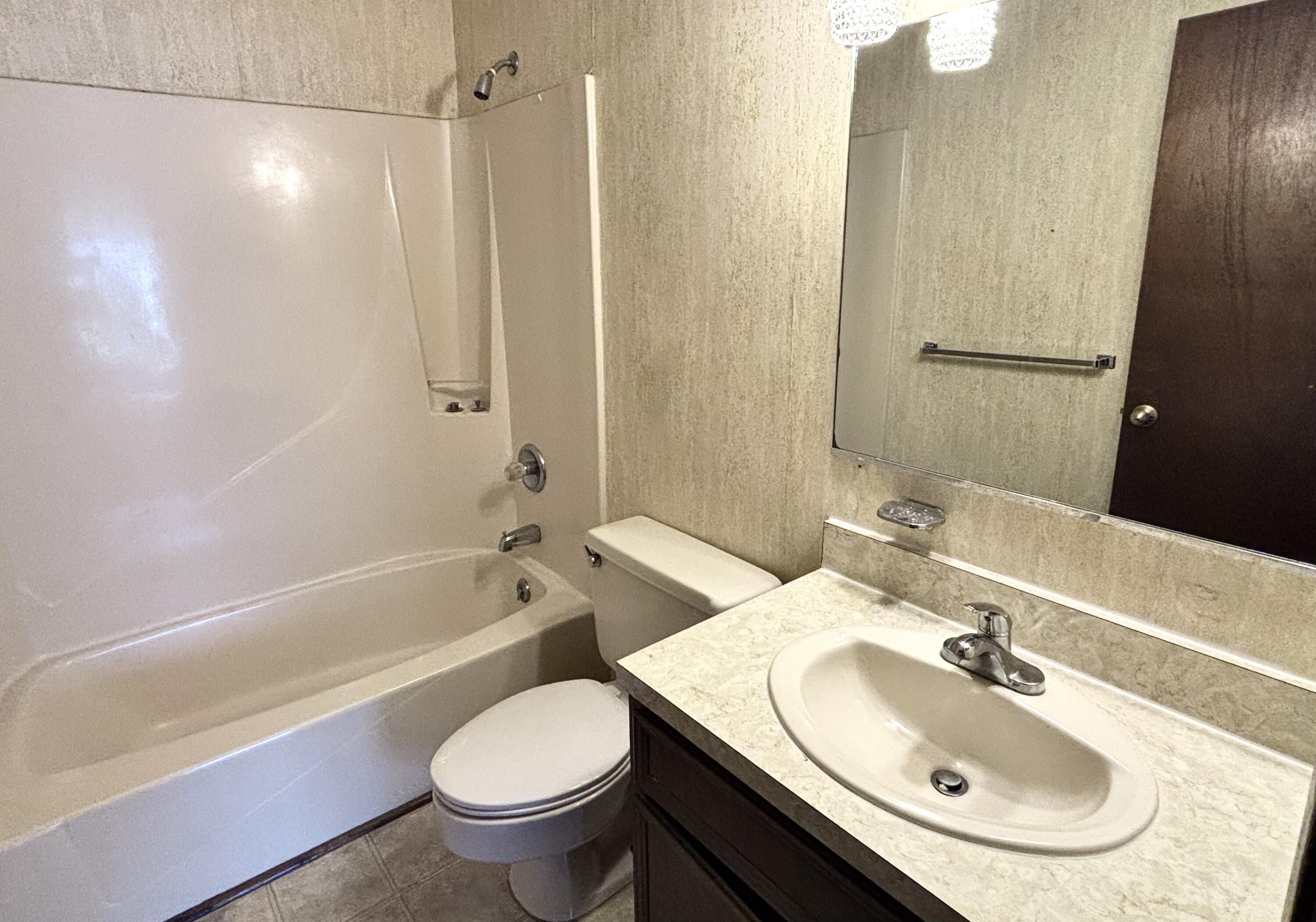 337 Lewis Street, Unit F Fort Walton Beach, FL 32547 - Photo 10 of 10 a bathroom with a sink toilet and shower