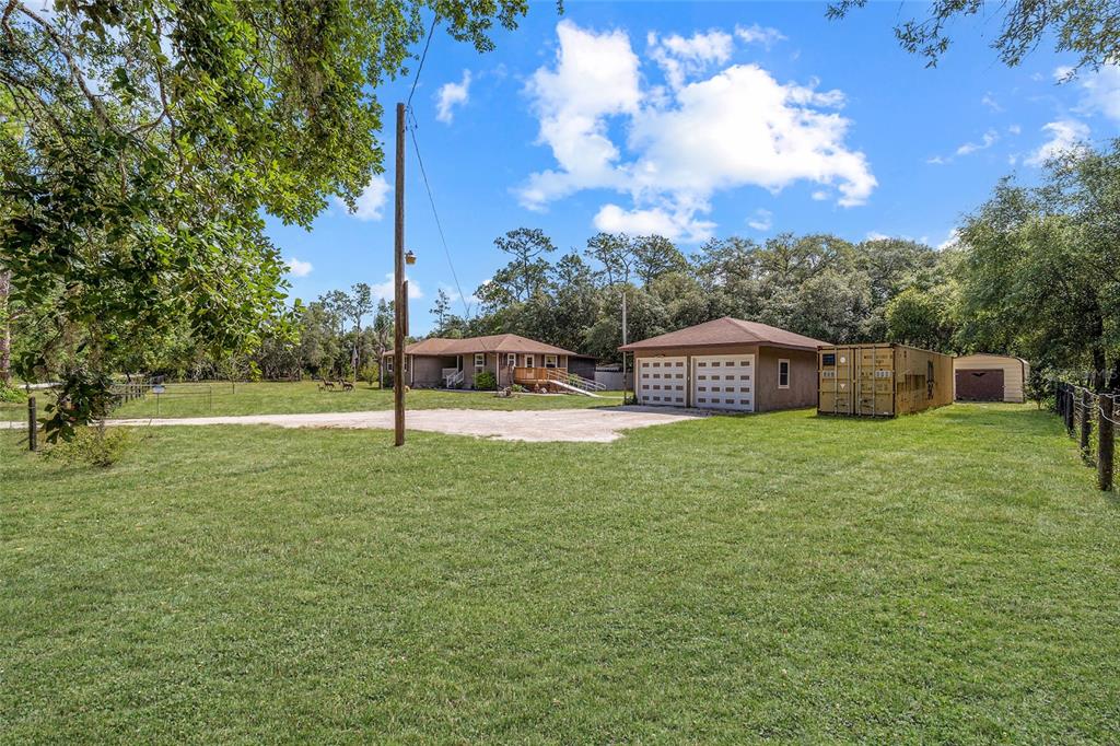 15755 Southwest 90th Avenue Dunnellon, FL 34432 - Photo 44 of 55 a view of a house with a yard