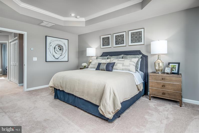 7920 Mine Run Road, Unit MOZART Hanover, MD 21076 - Photo 13 of 27 a bedroom with a bed and a night stand