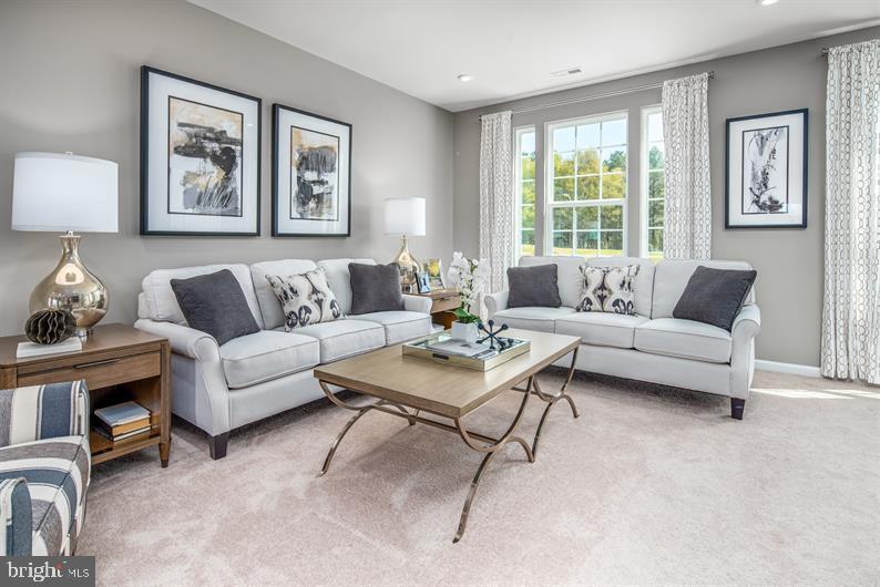 7920 Mine Run Road, Unit MOZART Hanover, MD 21076 - Photo 7 of 27 a living room with furniture and a large window