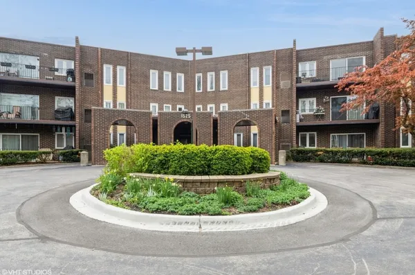 a view of a building with a garden