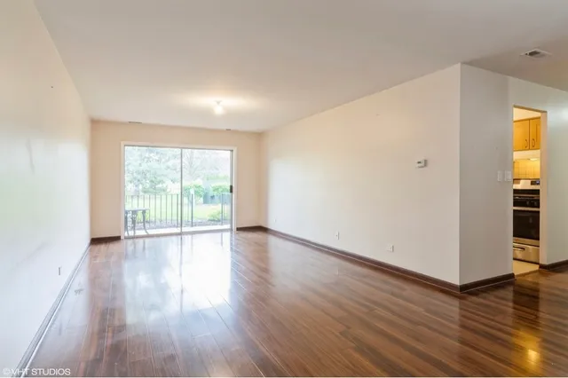 a kitchen with stainless steel appliances granite countertop a stove and a refrigerator