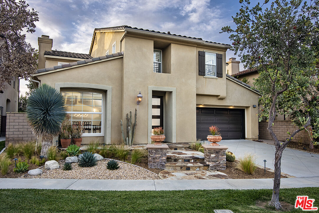 a front view of a house with yard