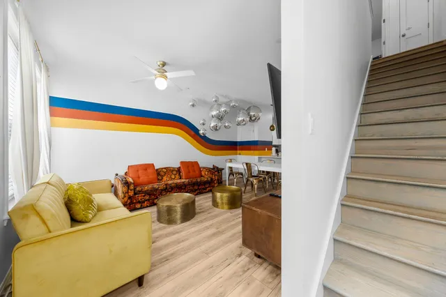 a view of living room with furniture and wooden floor