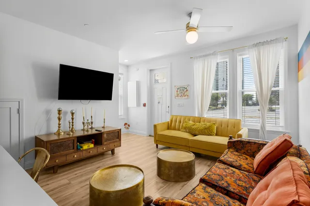 a living room with furniture and a table