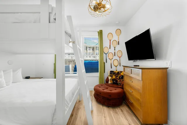 a bathroom with a granite countertop sink mirror and toilet