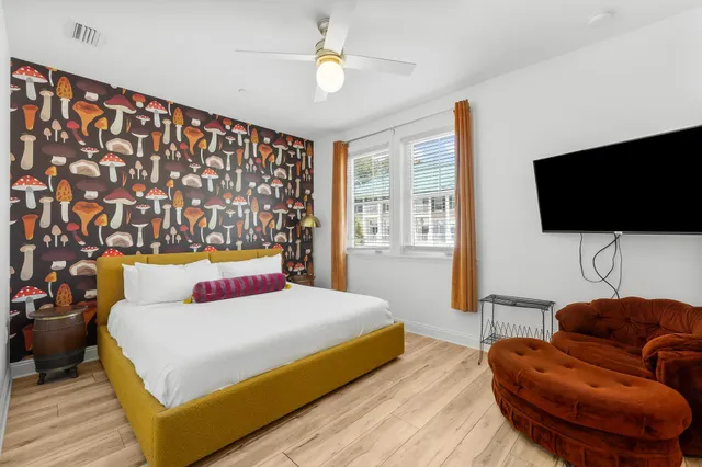 a bathroom with a granite countertop sink toilet and mirror
