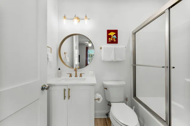 a bathroom with a sink vanity and a mirror
