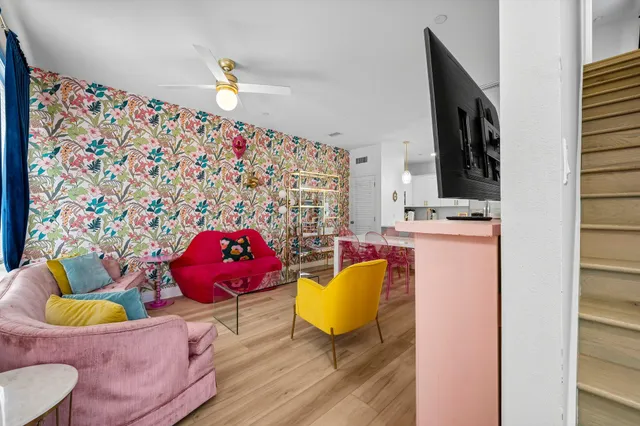 a bathroom with a granite countertop sink toilet and mirror